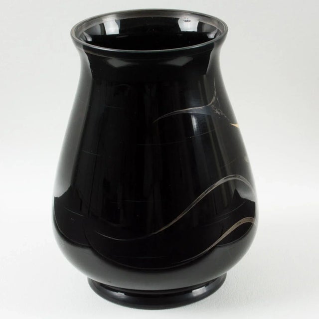An elegant 1930s French Art Deco black glass vase manufactured by Verreries d'Art de HEM and designed by Michel Herman....