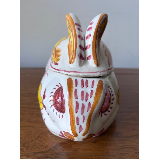 This charming vintage hand-painted Rabbit sauce tureen features Yellow and Red floral motifs on a Cream ground. Has...
