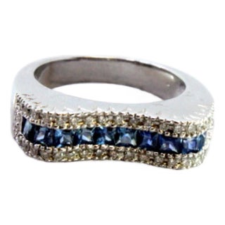 Gold Ring with Brilliant-Cut Diamonds and Central Blue Topazes For Sale