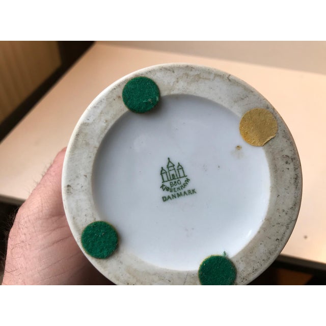 Art Deco style table light in white glazed porcelain. Commissioned by Le Klint and manufactured by Bing & Grøndahl in...