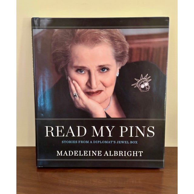 Fascinating book signed by Madeleine Albright about how she used her extensive and interesting collection of pins and...