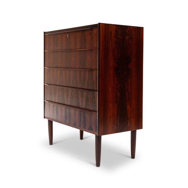 This stunning 1960s Danish Mid-Century rosewood tallboy dresser is a timeless piece of craftsmanship. Featuring exquisite...