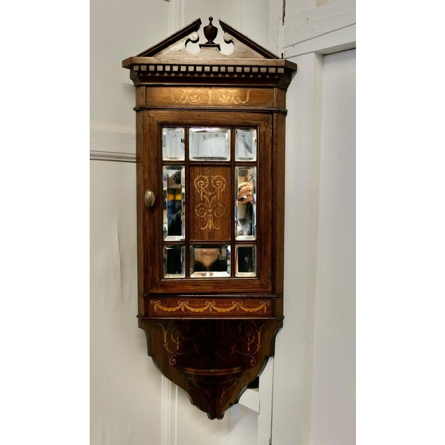 Edwardian Inlaid Corner Cupboard A Very attractive Corner Cupboard the door of the cabinet has 8 Bevelled Mirror panels...