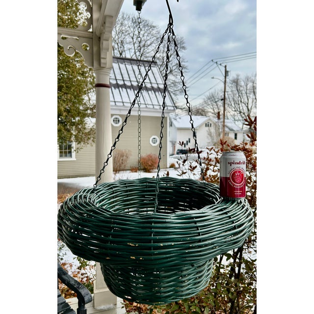 One-of-a-kind vintage hanging plant basket, likely from the 30s or 40s. Green wicker with a deep and rounded rim. Appears...