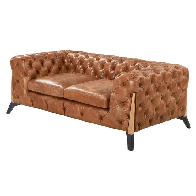 "We give you Olivia, a sophisticated contemporary spin on a classic Chesterfield design. Our signature leather with a...