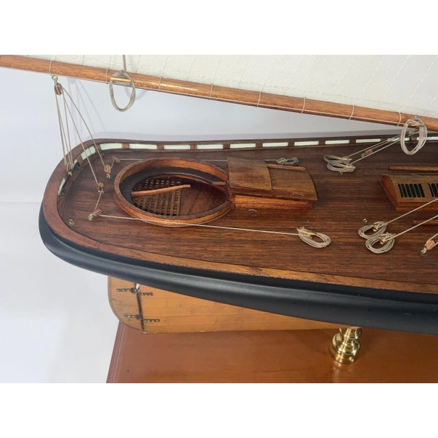 Sleek ship model of the famous Schooner Yacht "America", original winner of the America's Cup in 1851. Planked mahogany...