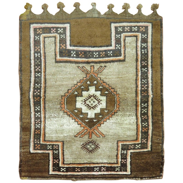 Vintage Turkish tribal throw rug featuring thick fringes in one end, circa mid-20th century, measures: 3'8" x 4'2".