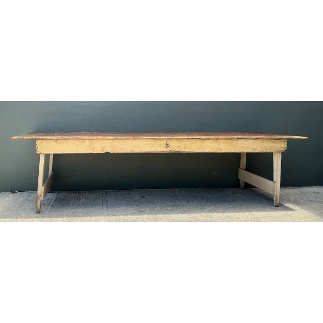 This vintage rustic wood farmhouse table brings authentic 1920s American history to any interior, having originally served...