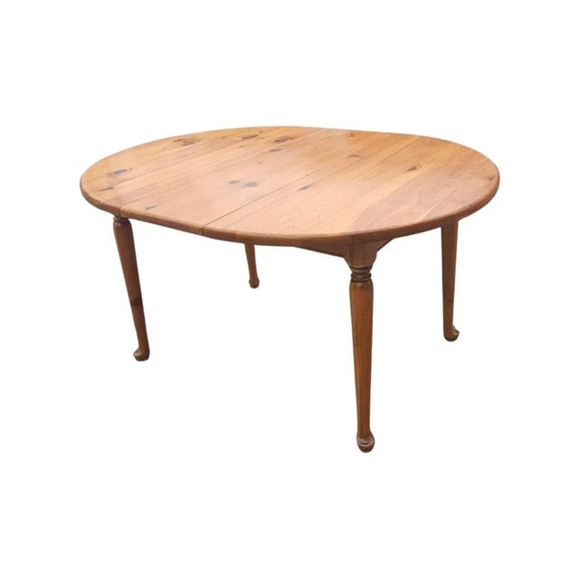 A Mid Century American Pine Extension Breakfast Table with Queen Anne feet. Measures 42" in diameter and stands 29" tall....