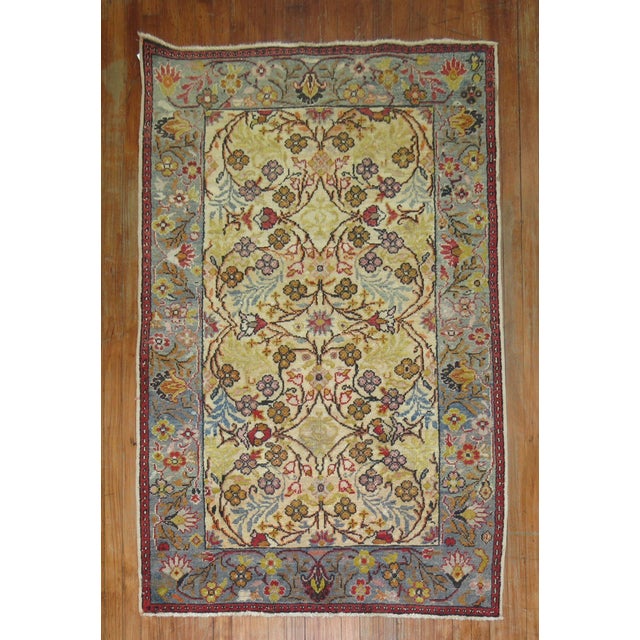 Mid-20th Century Turkish Rug with an elegant floral design throoughout. Measures: 3'9'' x 5'6''
