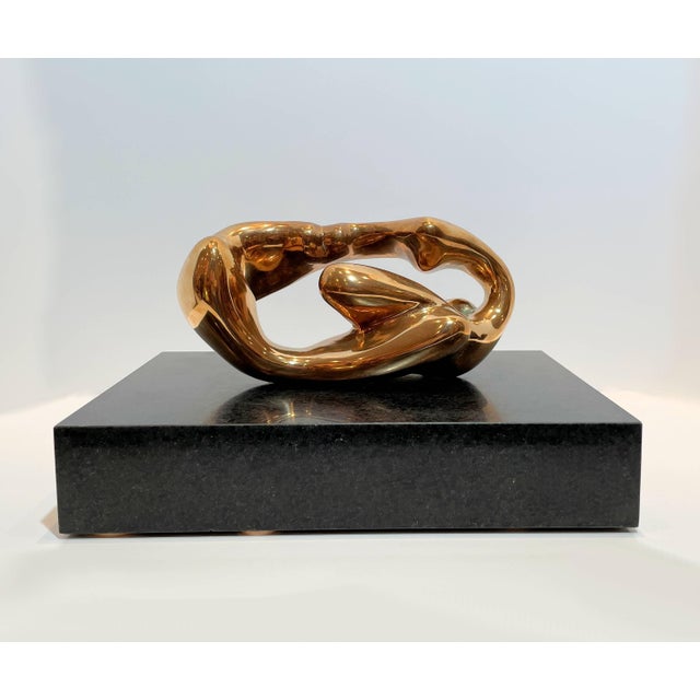 Polished Bronze Abstract Figural Sculpture, affixed to a stone base.