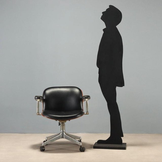 Swivel armchair designed by Ennio Fazioli for MIM in the 1960s, an example of period Italian design. The structure stands...