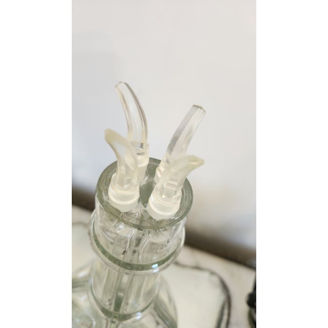 A sculptural vintage French four-chamber glass liqueur decanter, marked Made in France on the underside. This charming...