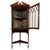 An exceptional 19th-century English corner cabinet by Webb & Co., finely crafted from mahogany in the Chippendale Revival...