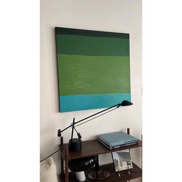 This artwork unfolds like a landscape of peaceful emotions, a dialogue between depth and light. Overlapping green bands...