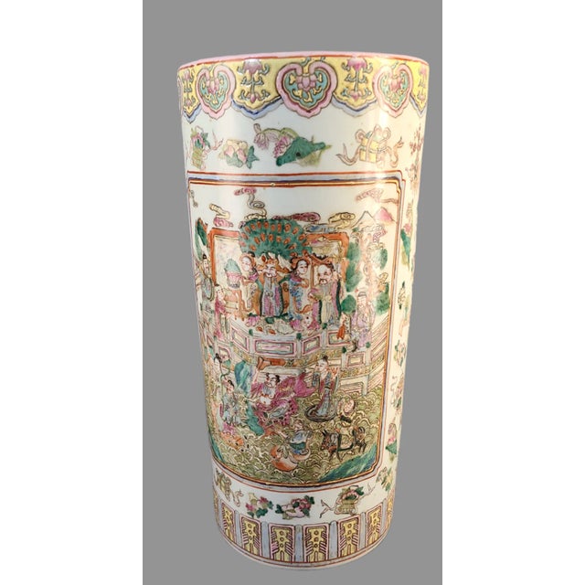This early 20th century Asian umbrella stand is a true work of art. Hand-painted with a colorful Famille Rose design, this...