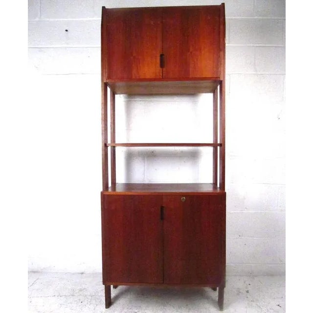 This vintage freestanding unit makes a wonderful addition to any home or office. Dual cabinets, including a lower record...