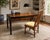 A striking vintage writing desk and coordinating chair designed by Raymond K. Sobota for Century Furniture’s celebrated...