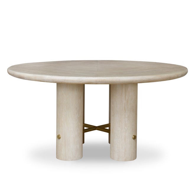 Antique brass metal X stretcher at base Materials: Oak Veneers, Oak Solids, Metal A part of the Cadence Collection.