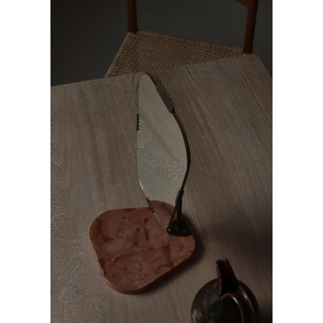 An elegant Swedish Grace table mirror from the 1940s, distinguished by its poised geometry and refined materiality. The...