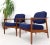 Pair of DUX Danish Modern teak lounge newly upholstery in navy blue fabric. Nice solid teak wrap around back connected...