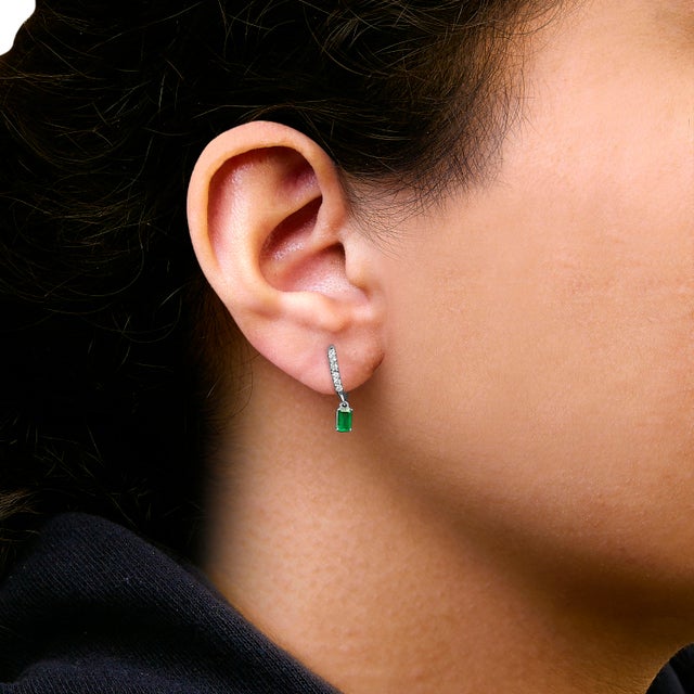 These exquisite earrings crafted from rhodium-plated 10K white gold embody classic elegance with a modern twist. Each...