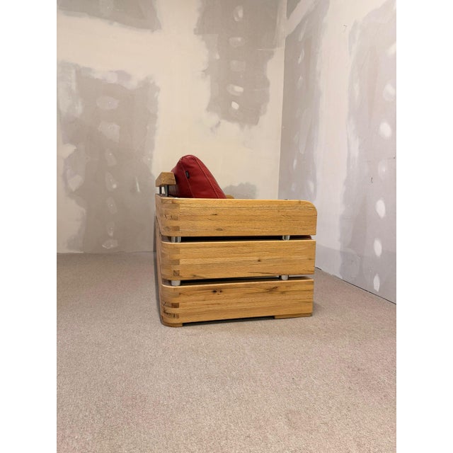 Solid wood sofa by Sprenger Möbel, handcrafted in Switzerland, upholstered in high-quality, soft red leather. This sofa...