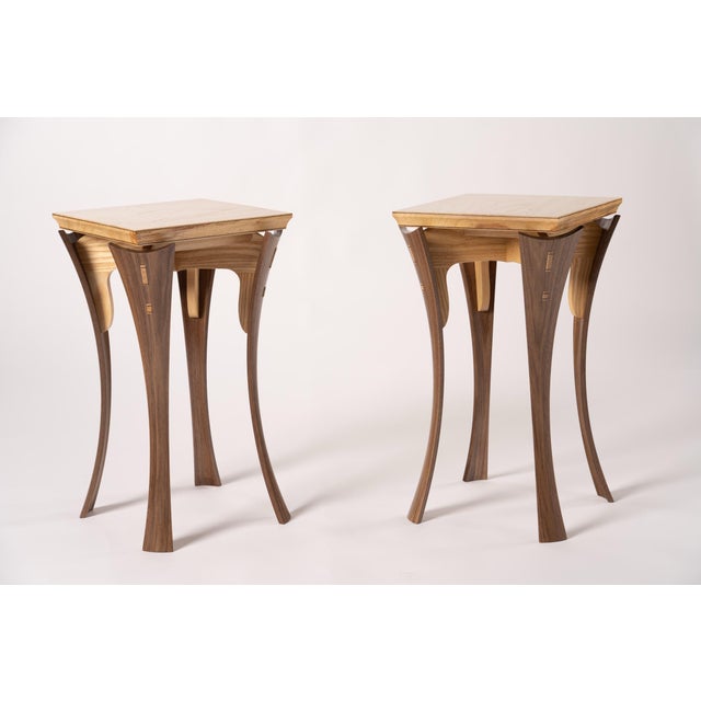 The walnut legs for these tables are intended to emulate curves found in nature. They are constructed through the process...