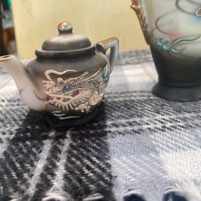 These are all beautiful pieces with matching designs on all of them. This set includes a small teapot, and plate with a...