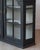 A striking 18th-century Swedish Gustavian hanging cupboard, distinguished by its elegant arched bonnet and beautifully...