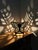 A vintage cast iron butterfly table lamp featuring an openwork design that transforms light into part of the piece itself....