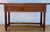 Spanish Renaissance Revival console table crafted in solid wood, dating from the 20th century. The front features two...