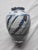 19th Century Earthenware Vase. Complete with white underglaze and painted geometric shapes. The glaze has a crackle...
