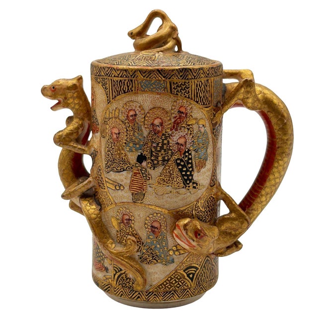 A finely detailed Meiji-period Satsuma earthenware sake pitcher attributed to Gyokushu, featuring exquisite polychrome and...