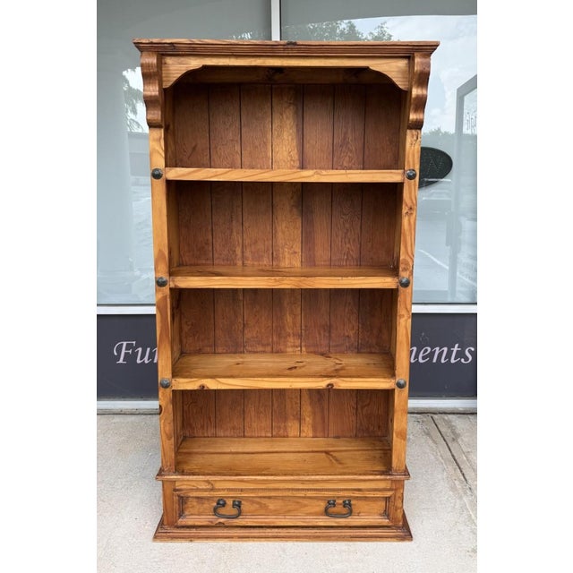 This solid pine bookshelf combines classic design with everyday functionality. Featuring four spacious shelves, a paneled...