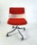 Off white plastic office swivel chair with orange/red wool fabric resting on an aluminium base with the original castors...