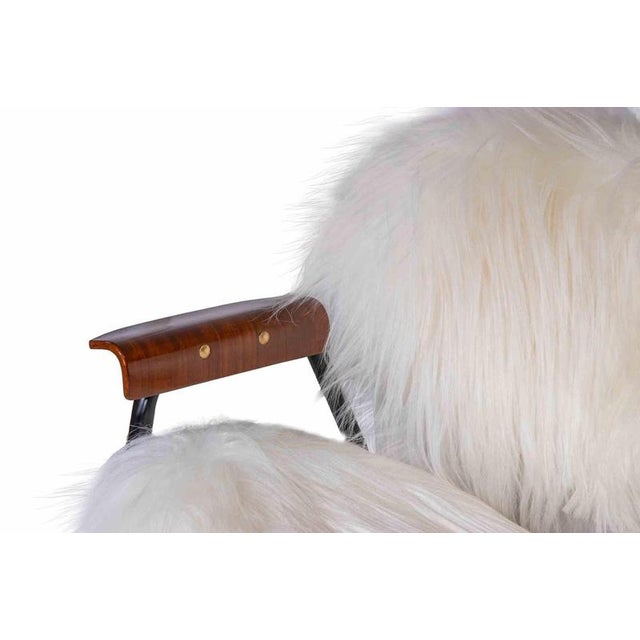 Vintage Armchair is a design item realized by Gastone Rinaldi for Rima in 1950s. An iconic chair in sheepskin, wood and...