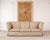 An elegant shelter-arm form sofa in a Fortuny attributed champagne and ivory damask upholstery designed by John Hutton for...