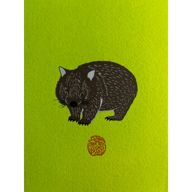 Absolutely charming original Japanese print by unknown artist of a brown wombat on a lime green background. Print on...