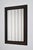 Carved ebonised wood mirror and trompe l'oeil turshell, XIXth c. Height: 158 cm - 62.2 in Length: 98 cm - 38.58 in Width:...