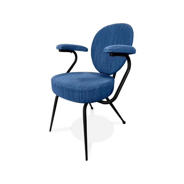 This Vintage Italian Mid-Century Modern Armchair, dating to the 1950s, features a distinctive sculptural silhouette that...