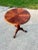 Early 20th Century pedestal tea table with ball and claw feet and inlaid wood top. Wood grain shines through beautifully...