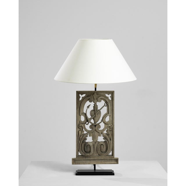 Made from a piece of reclaimed wooden ornament, this table lamp makes a truly unique accent. The base was originally...