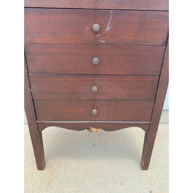 Amazing antique table crafted from wood in a rich brown finish. Features multiple storage drawers and the awesome,...