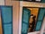 This captivating contemporary acrylic painting by Anna Maria Caboni presents the illuminated façade of an apartment...