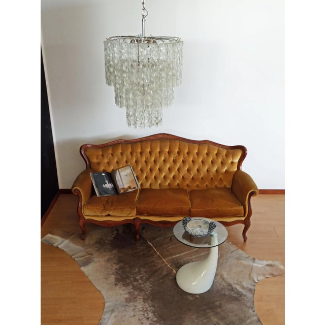 Vintage Italian Murano glass chandelier and nickel-plated metal structure. The shiny nickel armor supports 52 large clear...