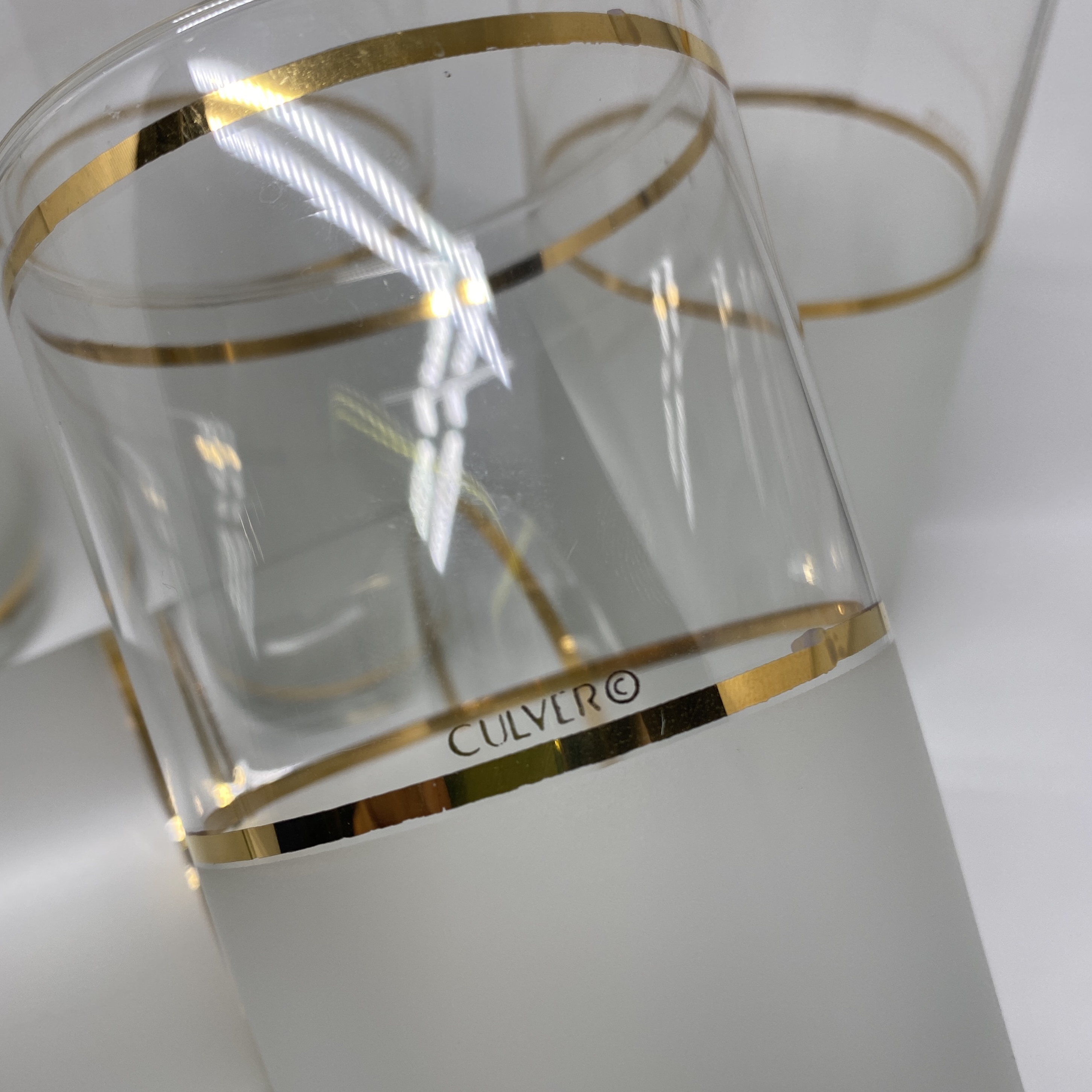 clear glasses with gold trim