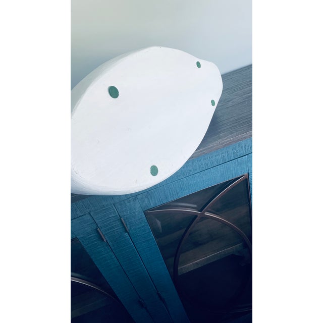 Beautiful hand carved white swan, light blues and grays sweep through the back.