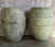 A pair of Mediterranean style barrel-form olive jars, commanding attention with their powerful sculptural presence and...