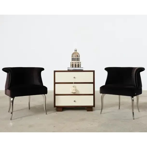 Opulent pair of plush velvet upholstered lounge chairs by Fendi Casa in an aubergine shade. The chairs feature a tulip...